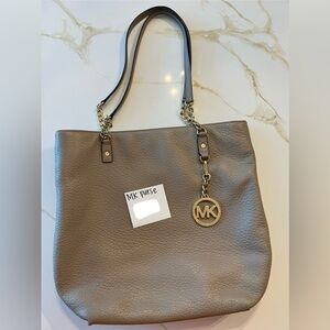 Michael Kors purse for sale. Tan with gold accents/chains. Good/Used condition.